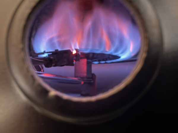 Blue gas burner flame viewed through a furnace sight glass