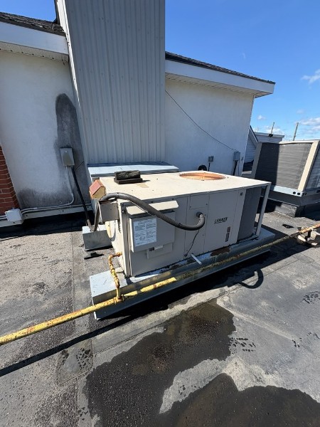 Lennox commercial rooftop HVAC unit on a flat roof